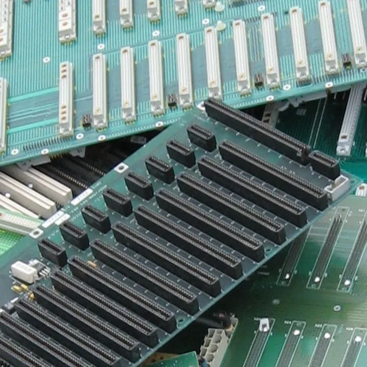 Rear walls / back panels from servers or mainframes are densely covered with gold-plated contact pins or connectors.
